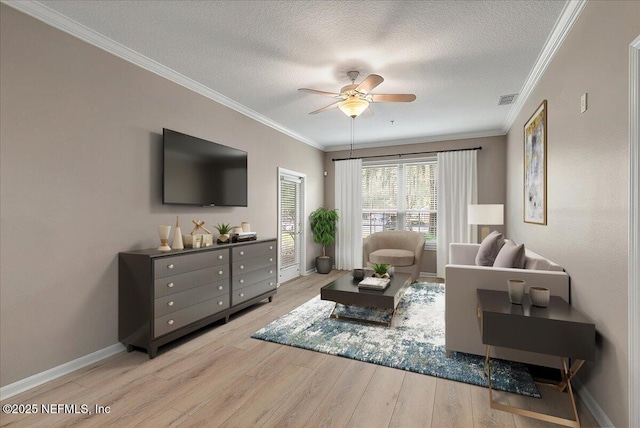 living room with ceiling fan, crown molding, a textured ceiling, and light hardwood / wood-style flooring