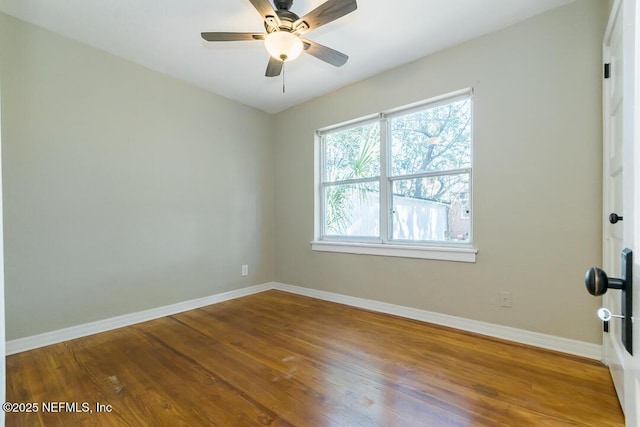 unfurnished room with hardwood / wood-style flooring and ceiling fan