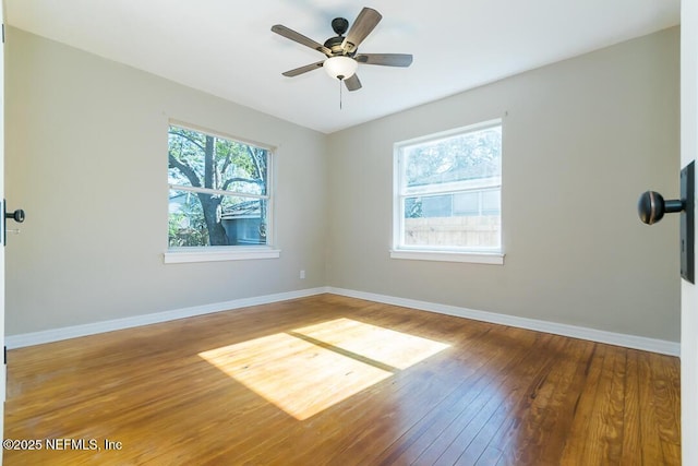 unfurnished room featuring hardwood / wood-style flooring and ceiling fan