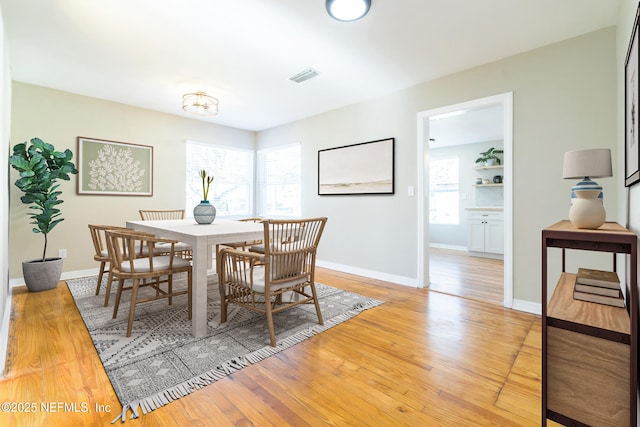 dining area featuring light wood-type flooring