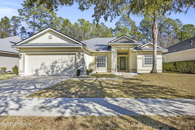 view of front of property with a garage and a front yard