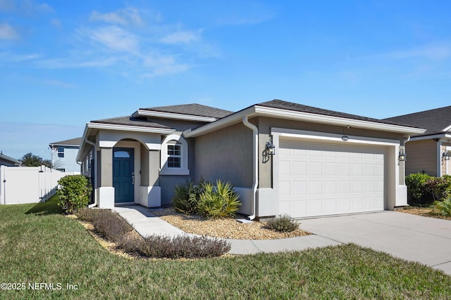 ranch-style home featuring a garage and a front lawn