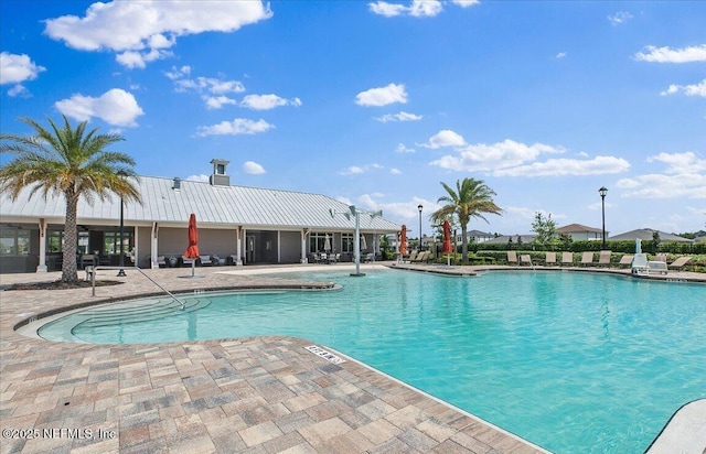 view of swimming pool with a patio