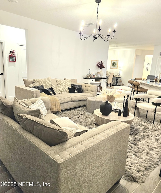 living room featuring an inviting chandelier