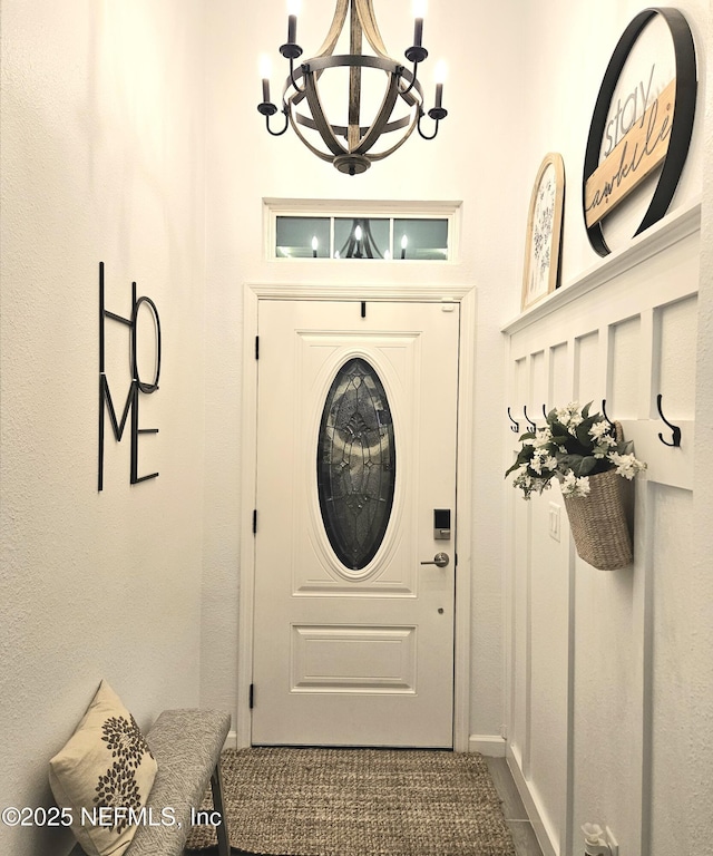 entryway with an inviting chandelier