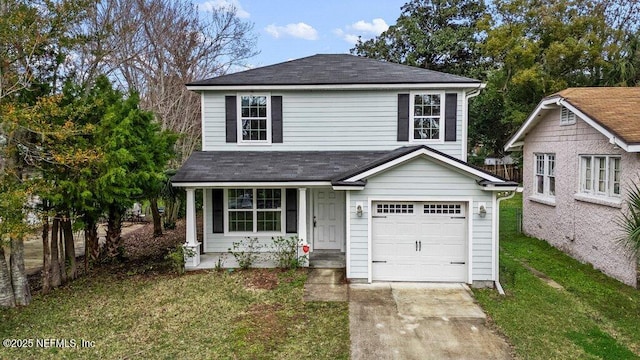 traditional-style house with a garage, driveway, fence, and a front yard