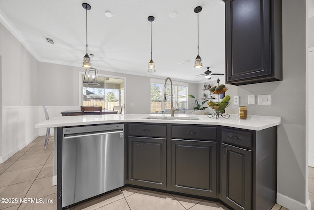 kitchen with ceiling fan, light tile patterned flooring, hanging light fixtures, stainless steel dishwasher, and sink