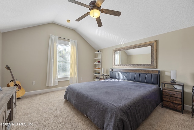 carpeted bedroom with ceiling fan, vaulted ceiling, and a textured ceiling