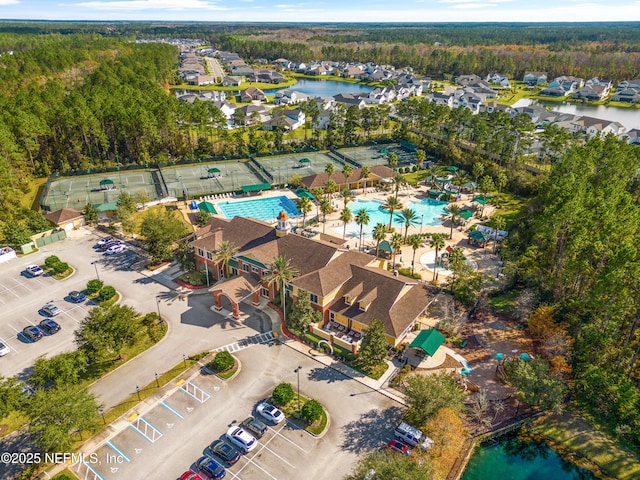 birds eye view of property with a water view