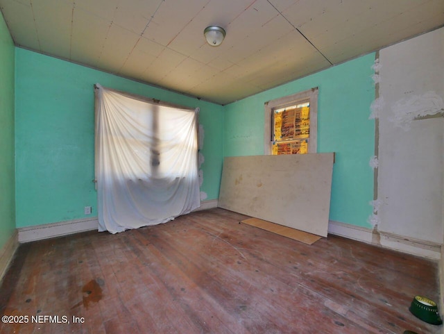 unfurnished room featuring hardwood / wood-style floors