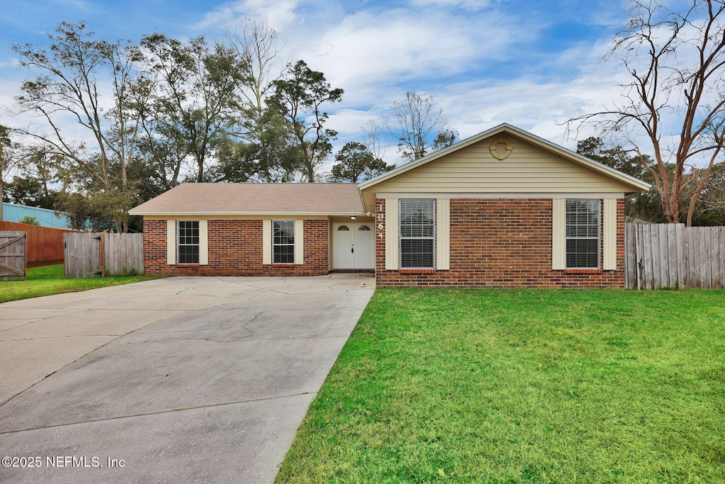 ranch-style house with a front lawn