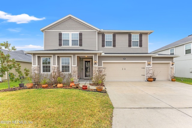 view of front of home featuring a front yard and a garage