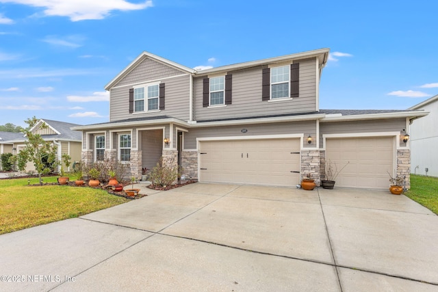 view of front of property with a garage and a front lawn