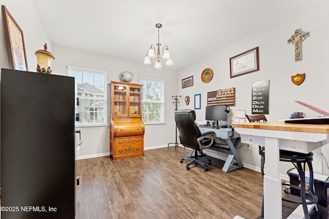 office space featuring wood-type flooring, a textured ceiling, and an inviting chandelier