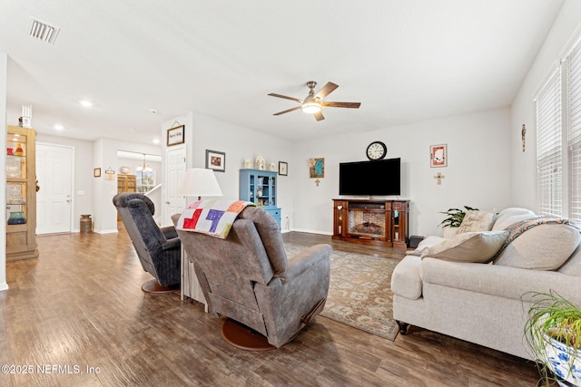 living room with hardwood / wood-style flooring and ceiling fan