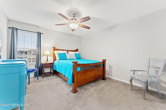 bedroom featuring ceiling fan and light colored carpet