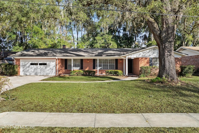 single story home featuring a garage and a front lawn