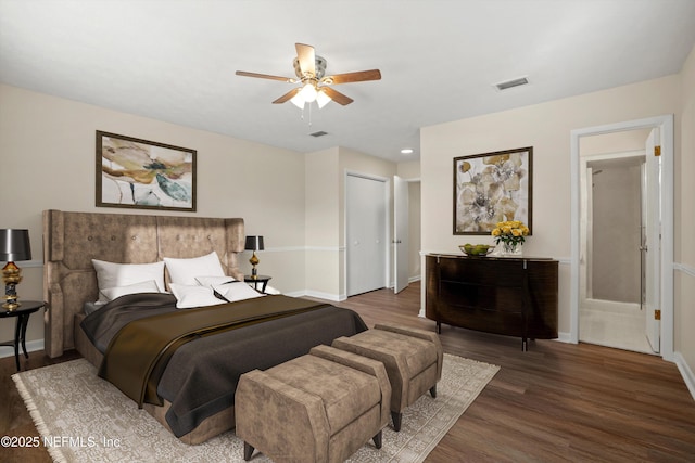 bedroom with a closet, ceiling fan, and dark hardwood / wood-style floors