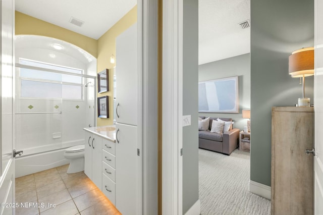 full bathroom featuring tile patterned flooring, vanity, toilet, and tub / shower combination