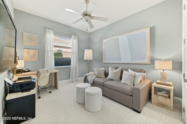 carpeted office featuring ceiling fan