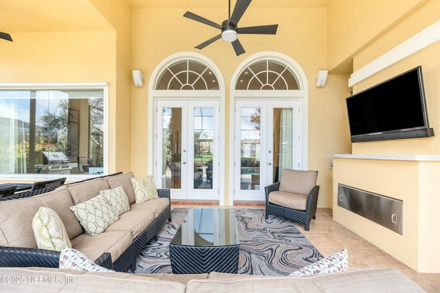 living room featuring ceiling fan, light tile patterned flooring, and french doors