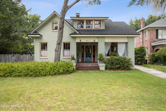 view of front facade with a porch and a front yard