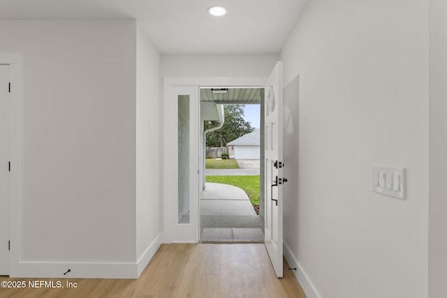 doorway to outside with light hardwood / wood-style floors