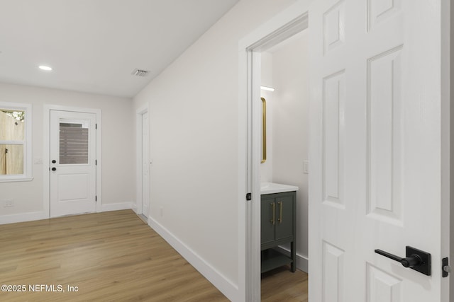 hallway featuring light hardwood / wood-style flooring