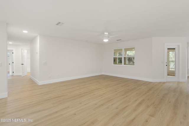 empty room with light hardwood / wood-style floors and ceiling fan