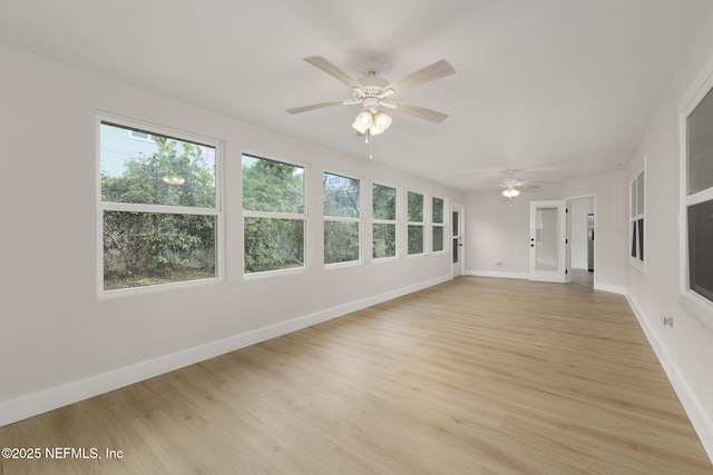 interior space with ceiling fan and light hardwood / wood-style flooring