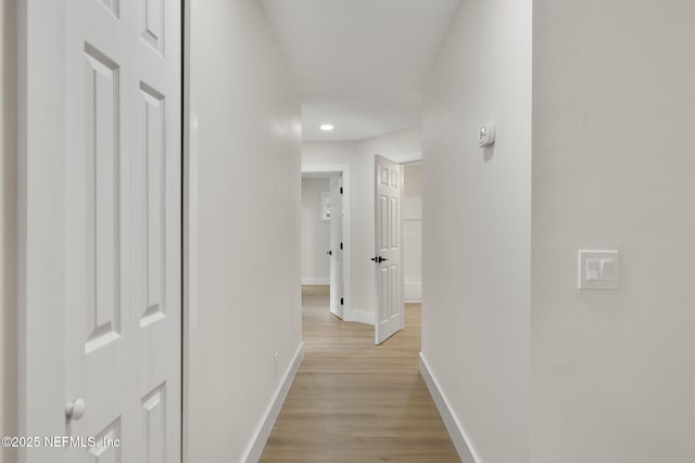 corridor featuring light hardwood / wood-style flooring