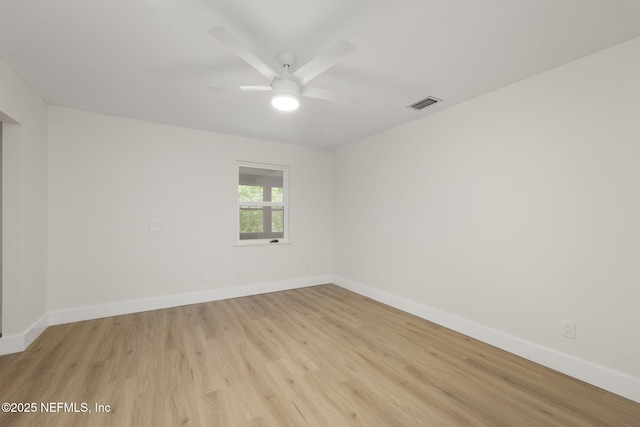 unfurnished room featuring ceiling fan and light wood-type flooring