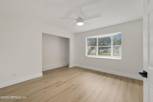 spare room with ceiling fan and light hardwood / wood-style flooring