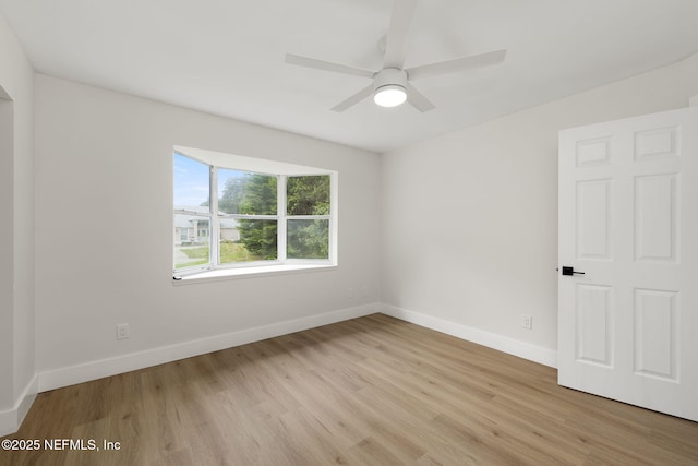 unfurnished room featuring ceiling fan and light hardwood / wood-style floors