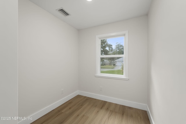 spare room featuring hardwood / wood-style floors