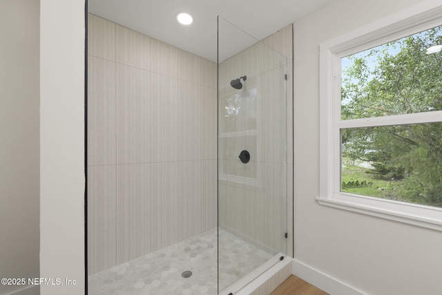 bathroom featuring tiled shower