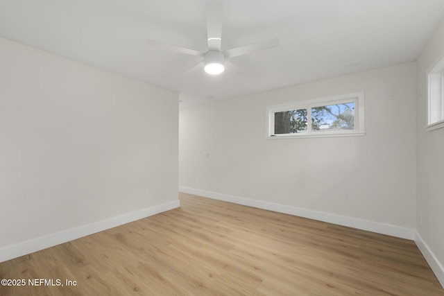 empty room with light wood-type flooring and ceiling fan