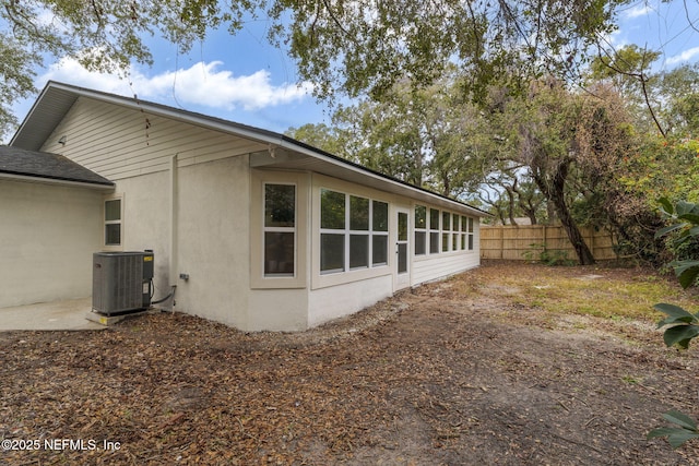 view of property exterior featuring central AC