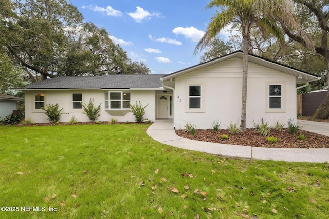 ranch-style home featuring a front yard