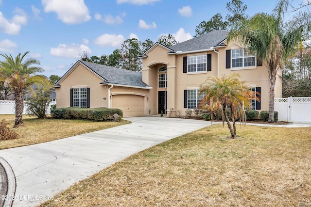 front facade with a garage and a front lawn