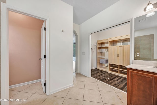 bathroom featuring vanity and tile patterned flooring