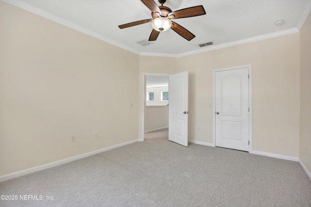 unfurnished bedroom featuring light carpet, ornamental molding, and ceiling fan