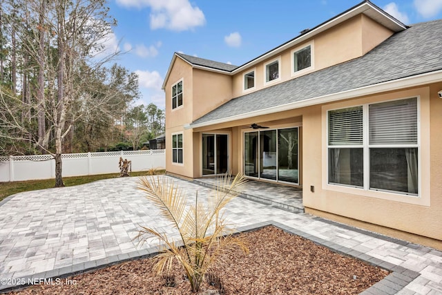 back of property featuring a patio and ceiling fan