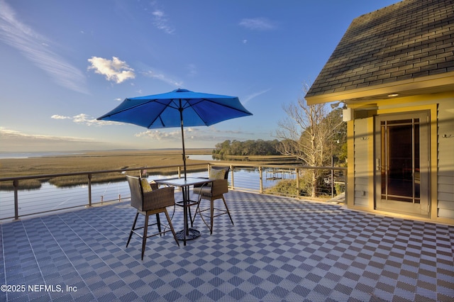 view of patio / terrace featuring a water view