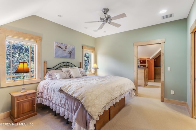 bedroom featuring ceiling fan, light colored carpet, and lofted ceiling