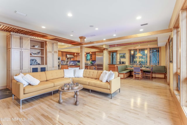 living room with light hardwood / wood-style floors