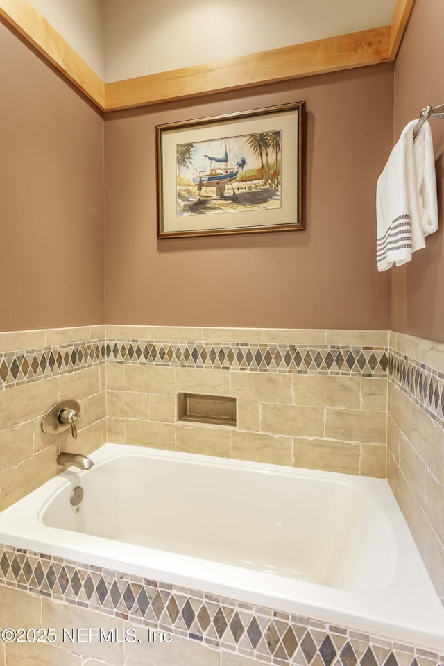 bathroom featuring tiled bath