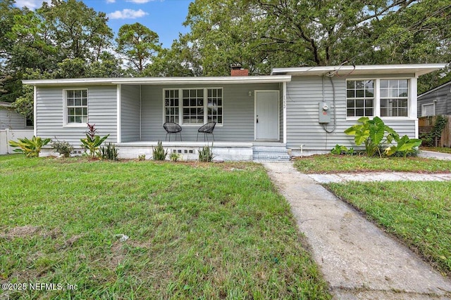 view of front of home featuring a front yard and a porch