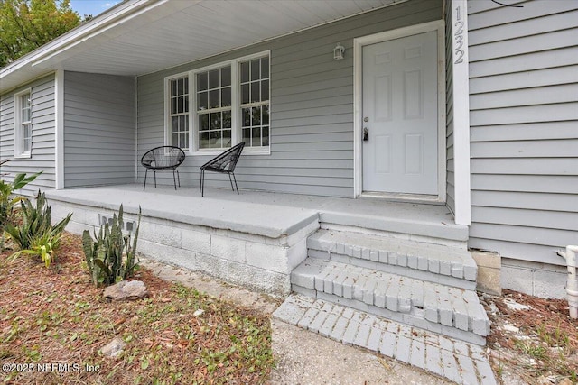 doorway to property with a porch