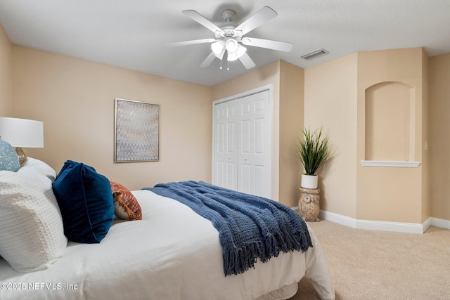 bedroom with carpet, a closet, and ceiling fan